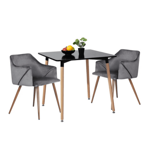Compact Square Dining Table with two gray chairs and decorative fruit bowl on top, ideal for small dining spaces.