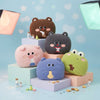 Colorful Animal Plush Pillows arranged playfully on pastel blocks, featuring cute animal faces perfect for decoration.