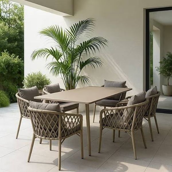 Luxury 6-Seater Outdoor Patio Dining Set featuring a stylish ceramic table and elegant seating in a modern outdoor setting.