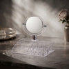 Acrylic Vanity Mirror Makeup Organizer with compartments on a marble surface, ideal for organizing beauty essentials.