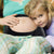 Adjustable Maternity Support Belly Band with a mother and child, showcasing comfort during pregnancy.