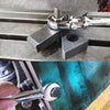 Flexible Head Carbon Steel Ratchet Wrench on a workbench demonstrating its pivoting capability.