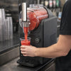 Professional Countertop Slushy Maker Electric Ice Machine dispensing a refreshing frozen drink.