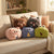 Colorful Animal Plush Pillows on a couch, featuring cute animal shapes for a playful home decor.