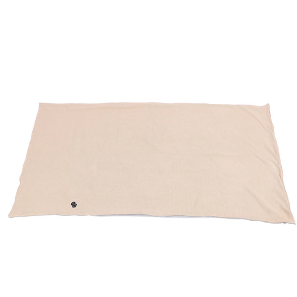 Portable Wearable Electric Heated Shawl Blanket in beige color, laying flat on a surface.