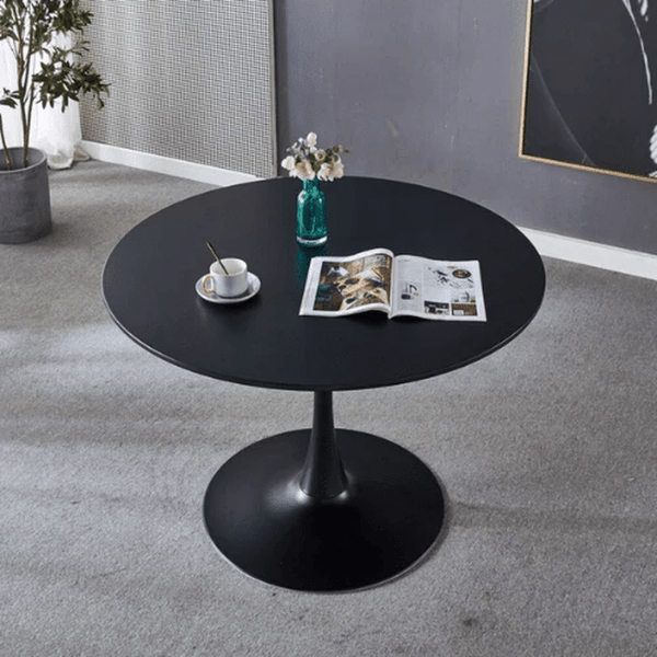Round Dining Table showcasing a stylish, space-saving design with a sleek black finish and contemporary decor.