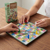 Mini Magnetic Snakes & Ladders Board Game with players rolling dice and moving pieces on a colorful board.