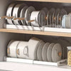 Adjustable Pots and Pans Organizer neatly displaying cookware and lids in a tidy kitchen cabinet.
