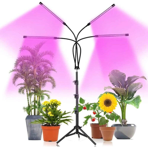 Wireless LED Grow Light for Indoor Plants illuminating various potted plants with full-spectrum lighting.
