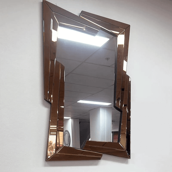 Ruby Wall Mirror with a unique geometric frame, enhancing light and style in any modern or classic interior.