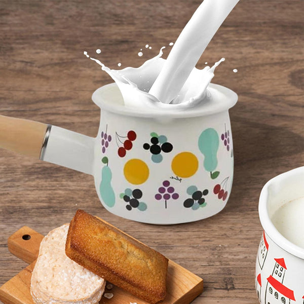 Small Enamel Milk and Butter Warming Pot with milk pouring and dessert on table