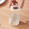 Magnetic Stainless Steel Spice Storage Box with lid being removed, showcasing its sleek design for kitchen organization.