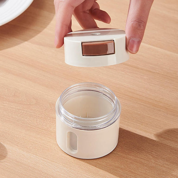 Magnetic Stainless Steel Spice Storage Box with lid being removed, showcasing its sleek design for kitchen organization.