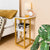 C Shaped Side Table with Charging Station beside a bed, showcasing stylish design and charging cables.