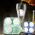 Sports Ice Ball Molds in football and basketball shapes filling a glass with beverage.