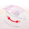 Foldable Toddler Soothing Vibrations seat with gentle vibrations in a pink design for calming toddlers.