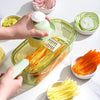 Multifunctional Vegetable Chopper in action, slicing carrots and cucumbers with ease.