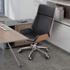Ergonomic High Back Leather Gaming Chair in a modern office setting with a workspace desk.