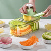 Multifunctional Vegetable Chopper with various sliced vegetables in bowls, showcasing its efficiency and design.