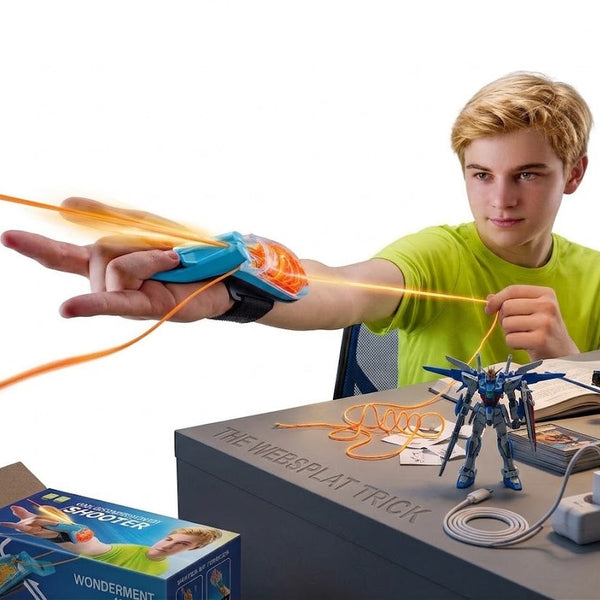 A child playing with a Glow-in-the-Dark String Launcher Toy, demonstrating its shooting action at a desk.