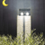 Motion Sensor Wall Light illuminating garden at night with moon in background.