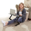 Adjustable Laptop Desk in use by a woman sitting comfortably on the floor with a laptop.