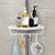 Multi Corner Shelf with bathroom essentials including soap dispensers and a loofah.