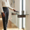 Luxury Glass Console Table with A-Shape Base styled with a book and a decorative vase in a modern interior.