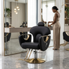 Professional Salon Styling Chair with Metal Base in a modern salon setting with a stylist at work.