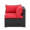 7 Seat Red Corner Patio Lounge Set corner chair with bold red cushions and black wicker base.