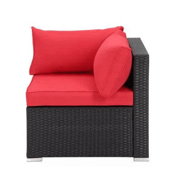 7 Seat Red Corner Patio Lounge Set corner chair with bold red cushions and black wicker base.