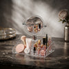 Acrylic Vanity Mirror Makeup Organizer with makeup products displayed on a marble countertop.