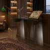 Luxury Glass Console Table with A-Shape Base in a stylish living room setup with books and decorative elements.