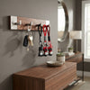 Silicone Superhero Keychain hanging on a wooden key rack with keys and decorative elements in a stylish home setting.