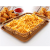 Copper Crispy Tray holding golden french fries with fried chicken and ketchup in the background.