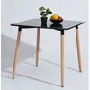 Compact Square Dining Table showcasing modern design with black top and wooden legs, perfect for small spaces.