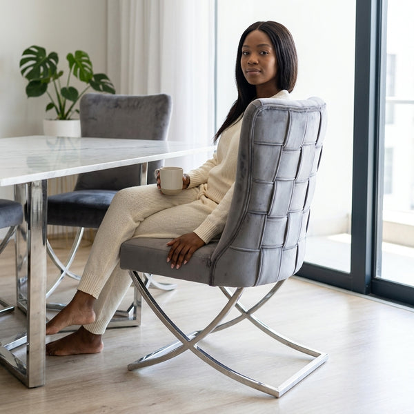 Grey Upholstered Dining Chair with Silver Frame, stylish seating solution in modern dining area.