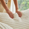 Person gently pressing on the soft fabric of a Round Corduroy Lounge Chair for Cozy Spaces.
