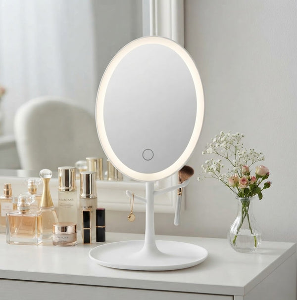 Oval LED Makeup Mirror with integrated lighting on a vanity table, enhancing beauty routines with clear reflection.