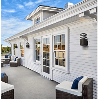 Glow Square Outdoor Wall Light mounted on modern white exterior wall, illuminating outdoor seating area.