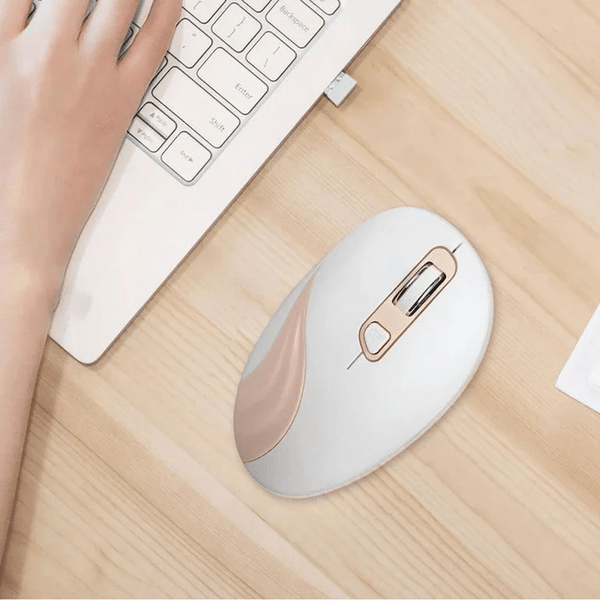 Wireless Ergonomic Optical Mouse 2.4 GHz USB beside a keyboard on a wooden desk, showcasing its sleek design.