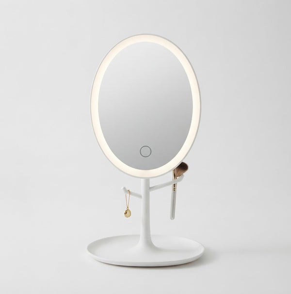 Oval LED Makeup Mirror with integrated lighting, perfect for vanity or dressing area.