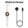 Beige Smartwatch with Android OS and charging cable in the box.