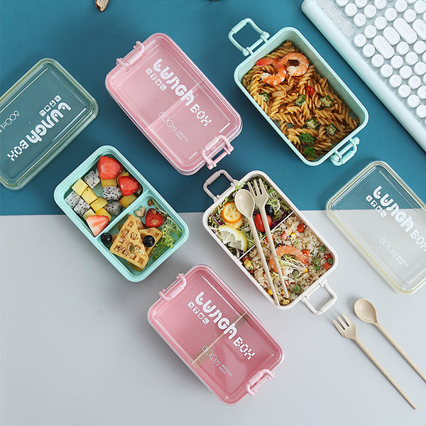 Airtight Compartment Lunch Box with colorful compartments holding various organized meals on a table with utensils.