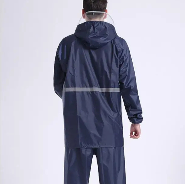 Man wearing a 210T Waterproof PU Coated Polyester Taffeta Fabric raincoat from the back.