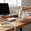 Cat-6E 10m High Speed 1000Mbps Ethernet Lan Cable connected to a laptop on a wooden desk.