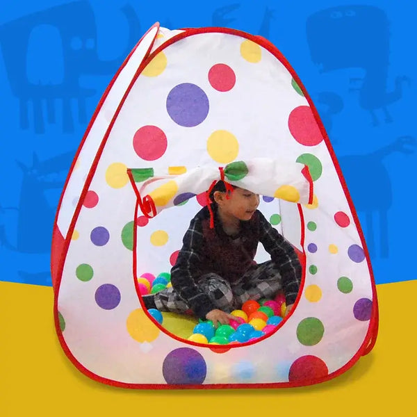 Child playing inside a colorful multifunctional folding childrens play tent filled with balls.