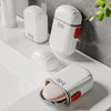 Compact Waterproof Travel Soap Case with Carry Handle displayed on a bathroom counter, showcasing its sleek design.