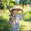 Child playing outdoors with Electric M416 Gel Splatter Blaster in a playful pose.