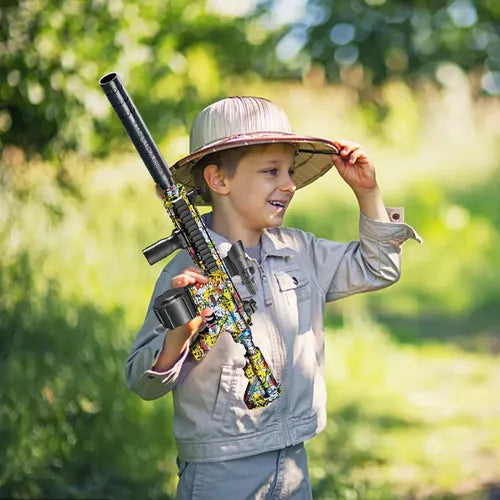 Child playing outdoors with Electric M416 Gel Splatter Blaster in a playful pose.